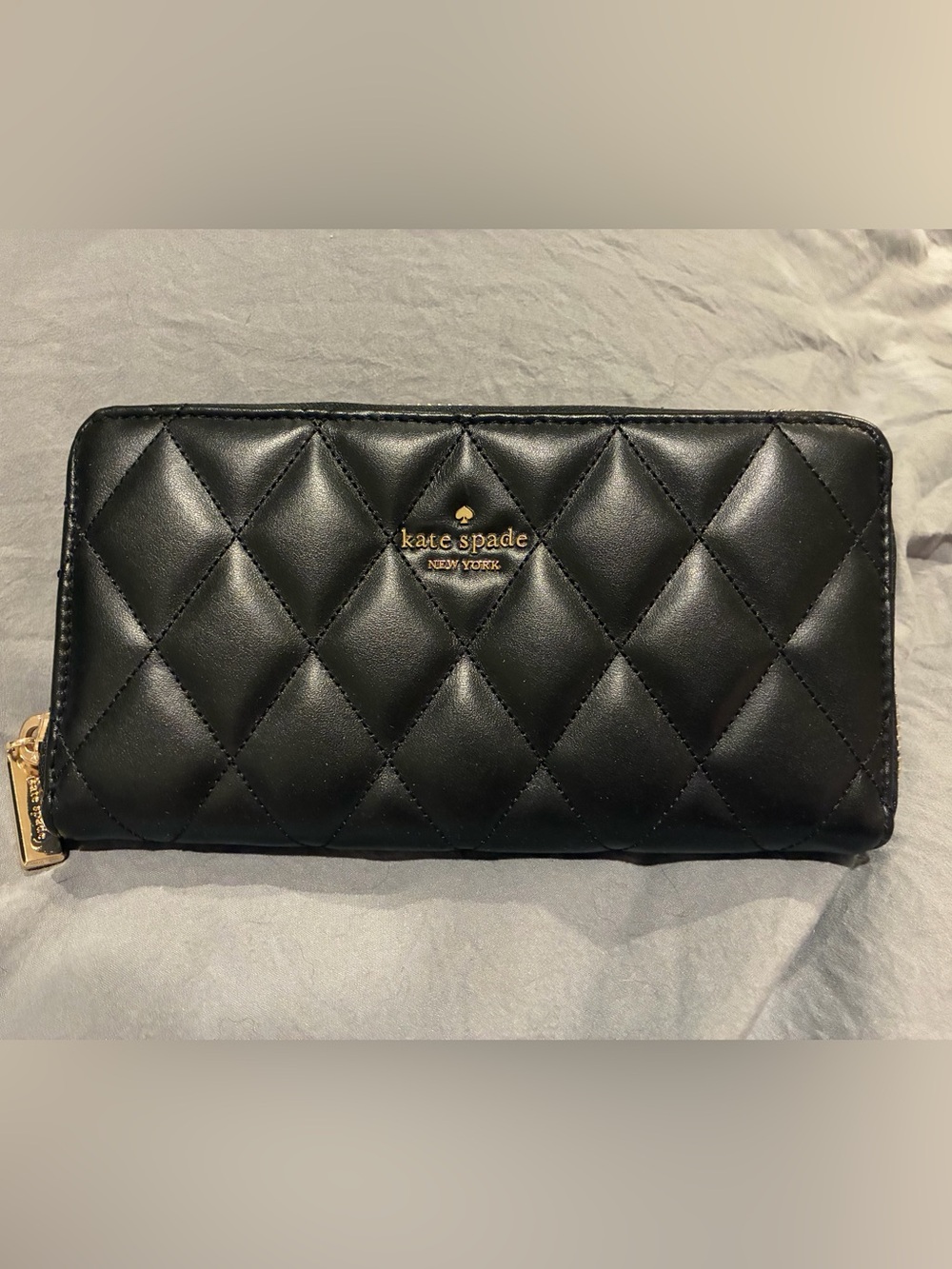 kate spade black quilted leather clutch with gold logo